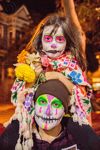 little girl with sugar skull makeup - sitting on man's shoulders - dia de los muertos, child, daughter, day of the dead, dia de los muertos, face painting, facepaint, father, flowers, halloween, kid, knitcap, little girl, man, neon colors, night, sugar skull makeup