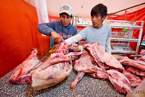 llama meat in meat shop (argentina), argentina, butcher, llama meat, meat market, meat shop, men, noroeste argentino, quebrada de humahuaca, raw meat, tilcara