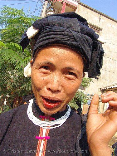 "lo lo den" tribe woman with red lips caused by chewing betelnut - vietnam, areca nut, asian woman, betel leaf, betel nut, betel quids, betelnut teeth, black lo lo tribe, bảo lạc, cau, headdress, hill tribes, indigenous, lo lo den tribe, lá trầu, necklace
