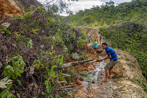 locals clearing landslide by hand, bada valley road landslide, men, mountain road, road to bada valley, roadwork, working