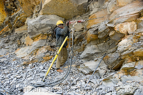 man drilling rock - drilling and blasting - near keylong - manali to leh road (india), compressed air drill, drilling and blasting, dynamite blasting, groundwork, man, road construction, roadworks, worker, working