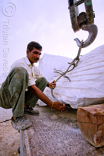 man hooking up white marble block to crane hook - production quarry (india), blocks, cable, crane hook, man, marble stone, portal crane, worker