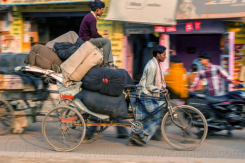 man sitting on top of large bags on cycle rickshaw (india), bags, cargo, cycle rickshaw, freight, heavy, load, men, moving, sacks, sitting, transport, transportation, transporting, varanasi, walking