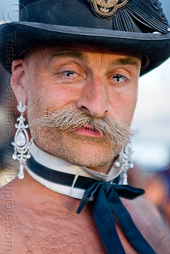 man with shirtless bow tie and earrings, attire, bow tie, burning man outfit, color contact lenses, contacts, costume, dickie bow, earrings, fashion show, mustache, randal smith, special effects contact lenses, stovepipe hat, theatrical contact lenses