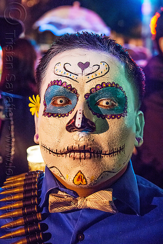 man with sugar skull makeup - white contact lenses - dia de los muertos, bow tie, bullet belt, bullets, color contact lenses, day of the dead, dia de los muertos, halloween, man, night, special effects contact lenses, sugar skull makeup, theatrical contact lenses, white contact lenses, white contacts