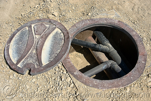 manhole - burning man metropolis, manhole cover, open, pipes