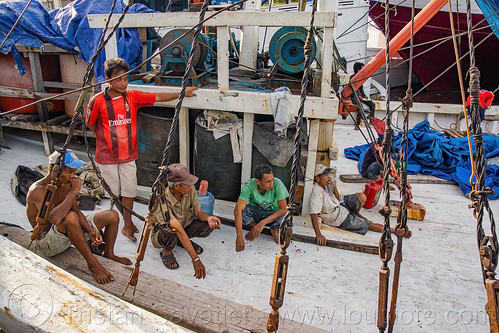 mariners on deck of a traditional pinisi boat (bugis schooner) at the makassar harbor, boat, bugis schooner, dock, harbor, makassar, men, pinisi, ship