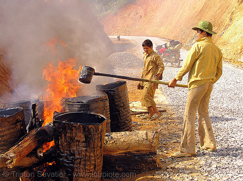 melting asphalt (bitumen) with wood fire - vietnam, air pollution, barrels, burning, environment, fire, groundwork, hot asphalt, hot bitumen, pavement, paving, road construction, roadworks