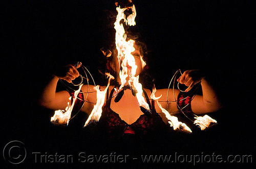 memory with fire fans - fire performer - temple of poi 2009 fire dancing expo - union square (san francisco), fire dancer, fire dancing expo, fire fans, fire performer, fire spinning, lena, memory, night, pyrotation, spinning fire, temple of poi, woman