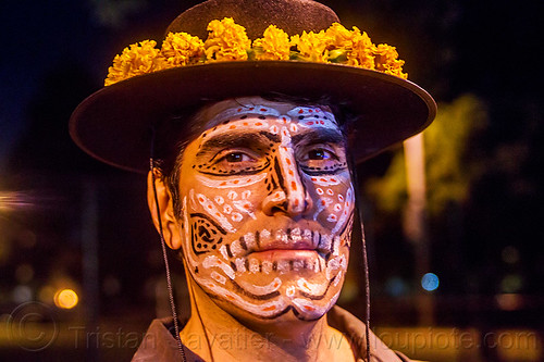 michael paim with sugar skull makeup - dia de los muertos (san francisco), day of the dead, dia de los muertos, face painting, facepaint, flower headdress, halloween, hat, man, marigold flowers, michael paim, night, sugar skull makeup