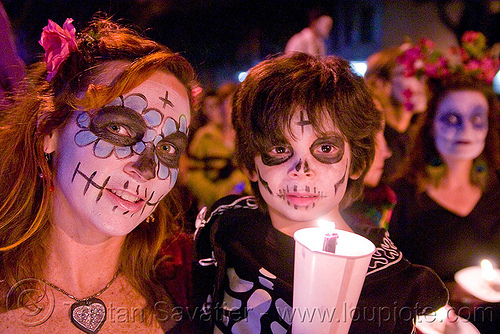 mother and child with skull makeup - dia de los muertos - halloween (san francisco), boy, candle light, child, day of the dead, dia de los muertos, face painting, facepaint, halloween, kid, mother, night, sugar skull makeup, woman