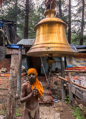 naga baba under large bell on the road to gangotri (india), baba, bell, bhagirathi valley, bhagwa, brass, hinduism, holy ash, man, naga babas, naga sadhus, sacred ash, sadhu, saffron color, vibhuti