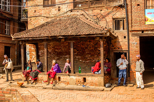 nepali people sitting in a pati (nepal), bhaktapur, pati, women