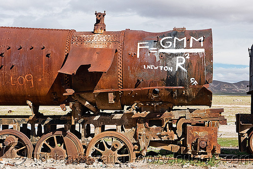 newton's universal law of gravitation equation - graffiti on steam locomotive, bolivia, enfe, equation, fca, graffiti, gravitation, newton, physics, railroad, railway, rusty, science, scrapyard, steam engine, steam locomotive, steam train engine, train cemetery, train graveyard, train junkyard, uyuni