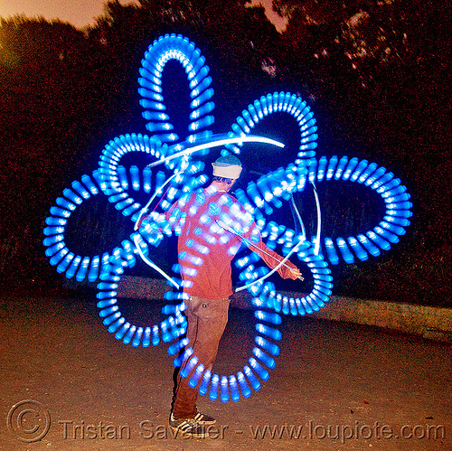 nicky spinning blue LED light poi, fire dancer, fire dancing, fire performer, fire spinning, glowing, led lights, led poi, led staff, light poi, light staffs, nicky evers, night, spinning fire