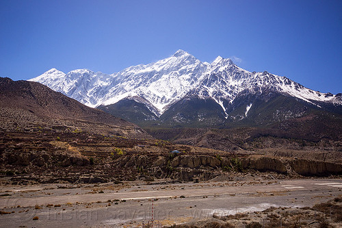 nilgiri summit behind the runway of jomsom airport - annapurnas (nepal), airport, jomsom, landscape, mountains, nilgiri, runway