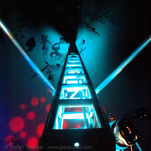 now I have to climb down this really high platform - burning-man 2006, burning man at night, glowing, ladder, platform