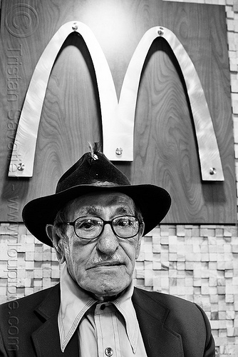 old man at mcdonalds restaurant, eyeglasses, eyewear, fast food, golden arches, hat, logo, mcdonalds, old man, pedro lopez-brito, pedro lópez-brito, prescription glasses, restaurant, spectacles