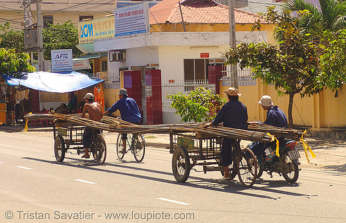 oversize load - cargo tricycles carrying rebars - vietnam, cargo tricycle, cargo trike, construction, freight tricycle, freight trike, nha trang, oversize load, rebars