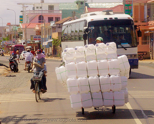 oversize load - plastic cans on tricycle - tricycle - vietnam, cargo tricycle, cargo trike, commerce, cycle rickshaw, freight tricycle, freight trike, jerrycans, oversize load, plastic cans, plastic containers, road, traffic