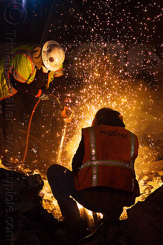 oxy-acetylene welding, dust mask, high-visibility jacket, high-visibility vest, light rail, man, muni, night, ntk, oxy-acetylene cutting torch, oxy-fuel cutting, railroad construction, railroad tracks, railway tracks, reflective jacket, reflective vest, safety glasses, safety helmet, safety vest, san francisco municipal railway, sparks, track maintenance, track work, welder, worker, working