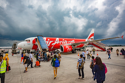 passengers boarding air-asia airbus a320, a320, air asia, airbus, cloudy sky, jakarta international airport, livery, passenger plane, tarmac