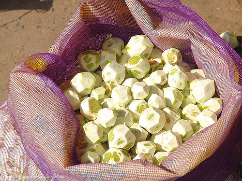 peeled limes in bag - thailand, bag, citrus, farmers market, fruits, lemons, limes, peeled, skinned