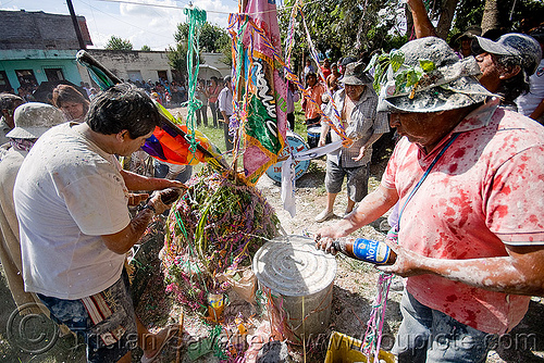 people offering beer to pachamama - apacheta - carnaval - carnival in jujuy capital (argentina), andean carnival, apacheta, argentina, carnaval de la quebrada, jujuy capital, man, noroeste argentino, pachamama, san salvador de jujuy