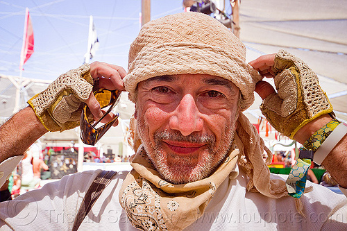 philippe glade, attire, bandana, burning man outfit, gloves, hat, open finger mittens, philippe glade, unshaven man