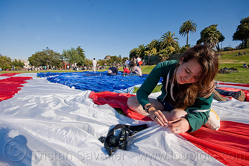 phoebe sewing the giant american flag - dolores park (san francisco), american flag, camera, giant flag, mending, phoebe, photographer, sewing, stitching, the flag project, us flag, woman