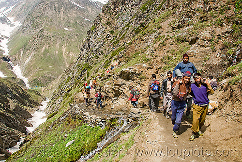 pilgrim on dandi / doli (chair carried by 4 bearers) - pilgrims on trail - amarnath yatra (pilgrimage) - kashmir, amarnath yatra, dandi, doli, hindu pilgrimage, kashmir, load bearers, men, mountain trail, mountains, pilgrims, wallahs