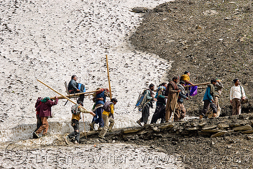 pilgrims on dandis / dolis (chairs carried by 4 bearers) on trail - amarnath yatra (pilgrimage) - kashmir, amarnath yatra, dandis, dolis, hindu pilgrimage, kashmir, load bearers, men, mountain trail, mountains, pilgrims, snow, wallahs