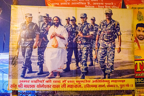 pilot baba with indian army soldiers - poster at kumbh mela 2013, fatigues, guru, hindu pilgrimage, hinduism, indian army, kumbh mela, men, military, night, pilot baba, poster, soldiers, uniform, walking, white robe