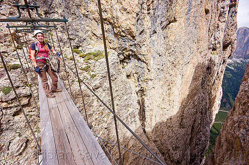 ponte tridentina - footbridge - via ferrata tridentina (dolomites), alps, catwalk, chasm, cliff, climber, climbing harness, climbing helmet, crossing bridge, dolomites, dolomiti, ferrata tridentina, footbridge, mountain climbing, mountaineer, mountaineering, mountains, ponte tridentina, rock climbing, suspension bridge, vertical, via ferrata brigata tridentina, woman