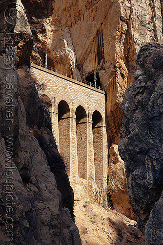 railroad viaduct along cliff - el chorro gorge (spain), canyon, cliffs, desfiladero de los gaitanes, el caminito del rey, el camino del rey, el chorro, gorge, mountaineering, mountains, rail bridge, railroad bridge, railway, viaduct