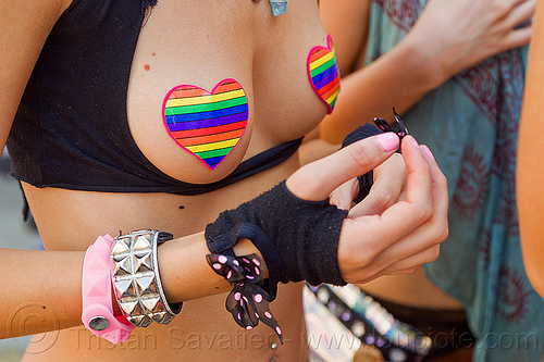 rainbow color heart shaped pasties, bow bracelet, brianna, gay pride festival, hand, heart pasties, open finger mittens, party fashion, rainbow colors, rainbow pasties, rave fashion, spiky bracelets, woman