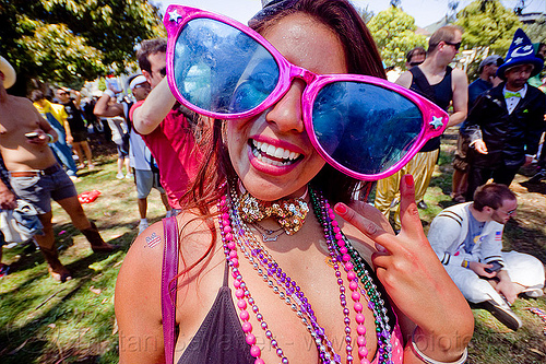 raver girl with oversize party sunglasses, bay to breakers, beads, footrace, necklaces, novelty sunglasses, oversize sunglasses, panhandle, raver, street party, woman