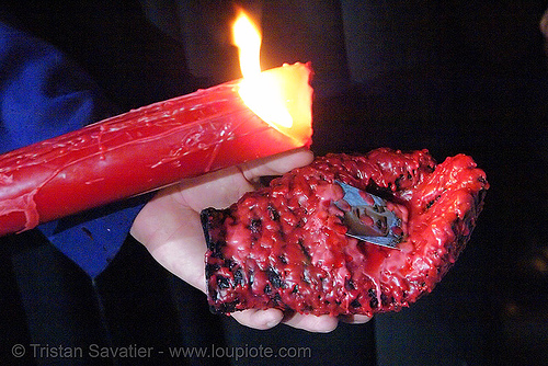 red candle dripping wax on glove - hermandad de san bernardo - semana santa en sevilla, candles, easter, glove, hermandad de san bernardo, madonna, maría santísima del refugio, nazarenos, night, red candle, semana santa, sevilla, virgin mary, wax, waxed