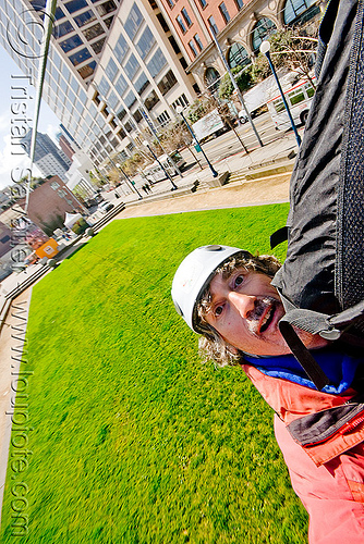 riding the zip-line over san francisco, adventure, cable line, cables, embarcadero, grass, hanging, helmet, landing, lawn, man, mountaineering, self portrait, selfie, steel cable, trolley, tyrolienne, urban, zip line, zip wire