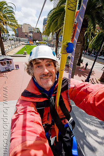 riding the zip-line over san francisco, adventure, cable line, cables, climbing helmet, embarcadero, hanging, man, mountaineering, self portrait, sling, steel cable, strap, trolley, tyrolienne, urban, zip line, zip wire