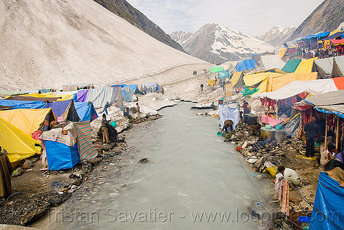 river and tent village near the cave - amarnath yatra (pilgrimage) - kashmir, amarnath yatra, encampment, hindu pilgrimage, kashmir, mountain river, mountains, pilgrims, river bed, tents