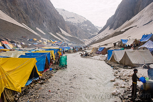 river and tent village near the cave - amarnath yatra (pilgrimage) - kashmir, amarnath yatra, encampment, hindu pilgrimage, kashmir, mountain river, mountains, pilgrims, river bed, tents