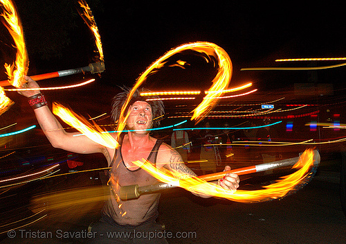 ro spinning fire staffs in the street, double staff, fire dancer, fire dancing, fire performer, fire spinning, fire staffs, fire staves, march of light, night, pyronauts, spinning fire