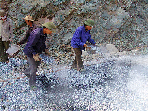 road paving - spraying gravel over hot asphalt - vietnam, gravel, groundwork, hot asphalt, hot bitumen, men, pavement, paving, road construction, roadworks, smoke, smoking, workers, working