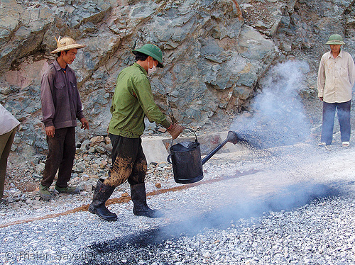 road paving - spraying hot asphalt over gravel - vietnam, gravel, groundwork, hot asphalt, hot bitumen, men, pavement, paving, road construction, roadworks, smoke, smoking, spraying, watering can, workers, working