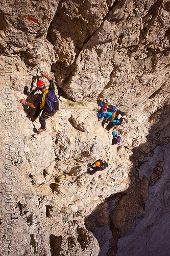 rock climbers on the passo santner via ferrata in the dolomites, alps, climbers, climbing helmet, dolomites, dolomiti, ferrata santner, mountain climbing, mountaineer, mountaineering, mountains, old snow, rock climbing, via ferrata del passo santner