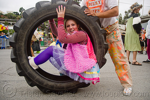 rolling in a tractor tire - burning man decompression 2009 (san francisco), david, dizzy hips, man, tractor tire, tractor tyre, woman