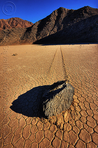 sailing stone closeup - death valley racetrack, cracked mud, death valley, dry lake, dry mud, mountains, racetrack playa, rock, sailing stones, sliding rocks
