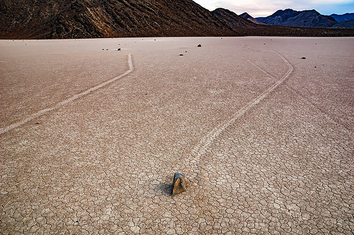 sailing stones on the racetrack - death valley, cracked mud, death valley, dry lake, dry mud, landscape, mountains, racetrack playa, sailing stones, sliding rocks
