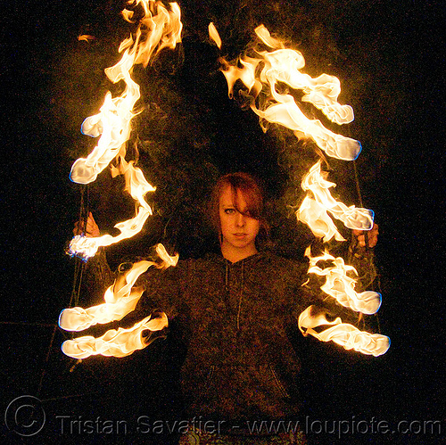 samantha with fire fans (san francisco), fire dancer, fire dancing, fire fans, fire performer, fire spinning, night, red hair, redhead, sam, samantha, spinning fire, woman